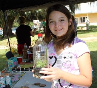 Girl with terrarium she planted.