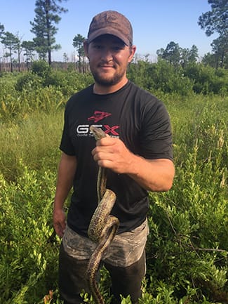 Kyle Lundsford with yellow rat snake