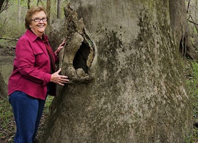 Woman next to a tree