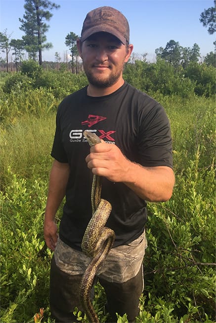 Intern Holding Red Snake