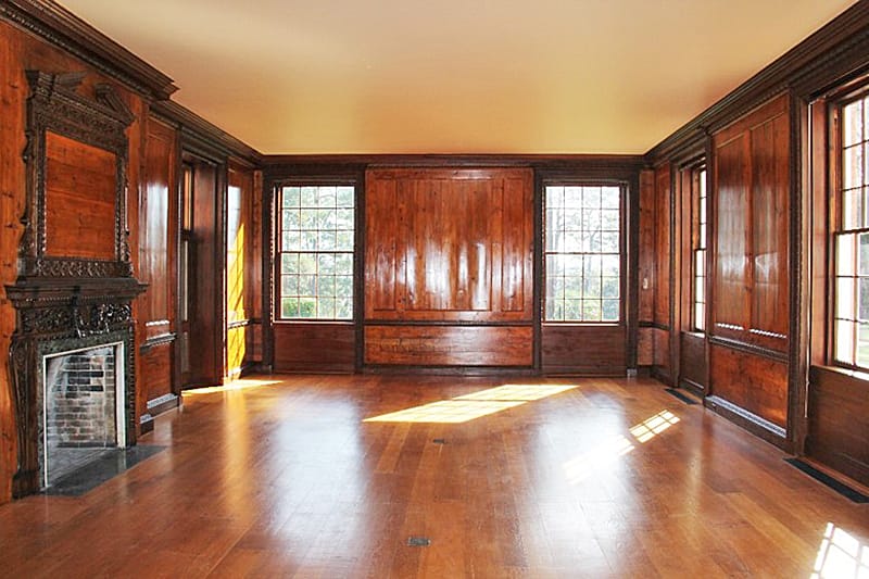 The historic paneling in the living room had been poorly refinished at some point unknown to Tall Timbers, and it was dark and dingy. After detailed surface testing and research, IFACS restored the living room paneling and trim to its original finish.